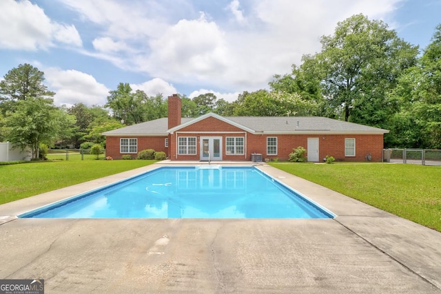 101 Coldbrook Cir, Rincon, GA 31326 - outdoor pool with french doors and view of wooded area