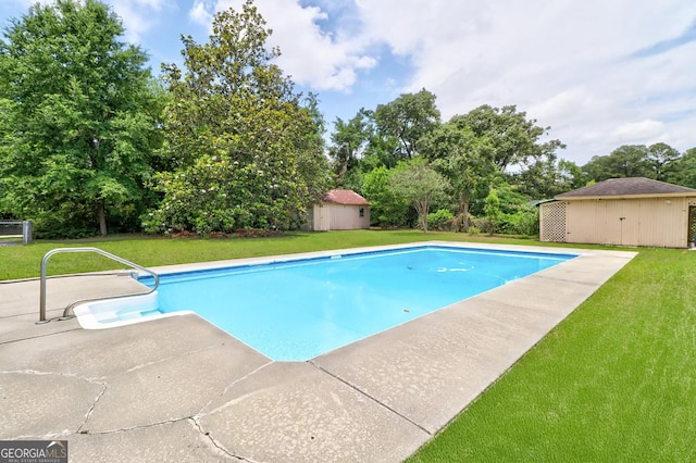 101 Coldbrook Cir, Rincon, GA 31326 - swimming pool with a yard, view of scattered trees, a patio area, and a storage shed