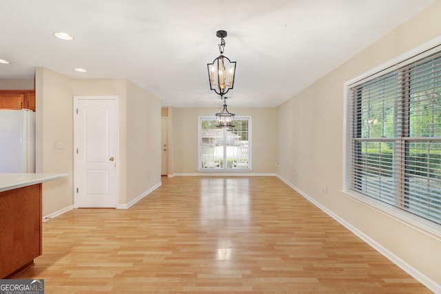 101 Coldbrook Cir, Rincon, GA 31326 - unfurnished dining area featuring a chandelier, light wood-type flooring, and recessed lighting