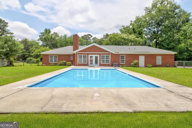 101 Coldbrook Cir, Rincon, GA 31326 - outdoor pool featuring french doors, view of scattered trees, and a patio