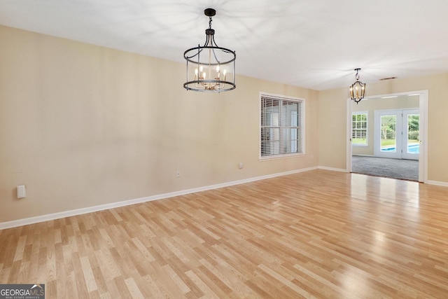 101 Coldbrook Cir, Rincon, GA 31326 - unfurnished room featuring a chandelier and light wood-type flooring