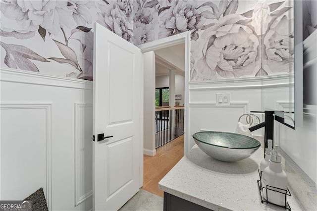 5705 Registry Oaks Ln SE, Mableton, GA 30126 - bathroom featuring wallpapered walls and vanity