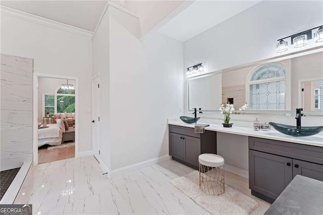 5705 Registry Oaks Ln SE, Mableton, GA 30126 - ensuite bathroom featuring double vanity, marble look tile flooring, crown molding, and a high ceiling
