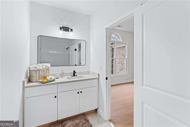 5705 Registry Oaks Ln SE, Mableton, GA 30126 - bathroom featuring vanity, marble look tiles, and baseboards