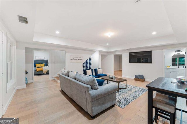 5705 Registry Oaks Ln SE, Mableton, GA 30126 - living room with a raised ceiling, stairs, light wood-style floors, and recessed lighting