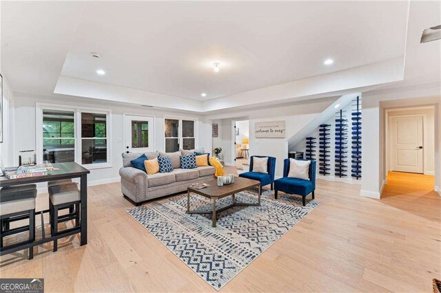 5705 Registry Oaks Ln SE, Mableton, GA 30126 - living area featuring a tray ceiling, light wood-style floors, baseboards, and recessed lighting