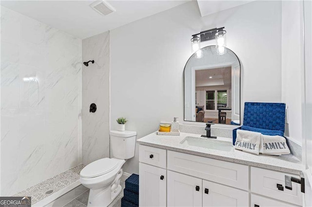 5705 Registry Oaks Ln SE, Mableton, GA 30126 - ensuite bathroom featuring vanity, a marble finish shower, and toilet