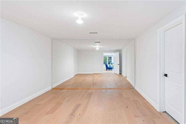 5705 Registry Oaks Ln SE, Mableton, GA 30126 - hallway featuring light wood finished floors and baseboards