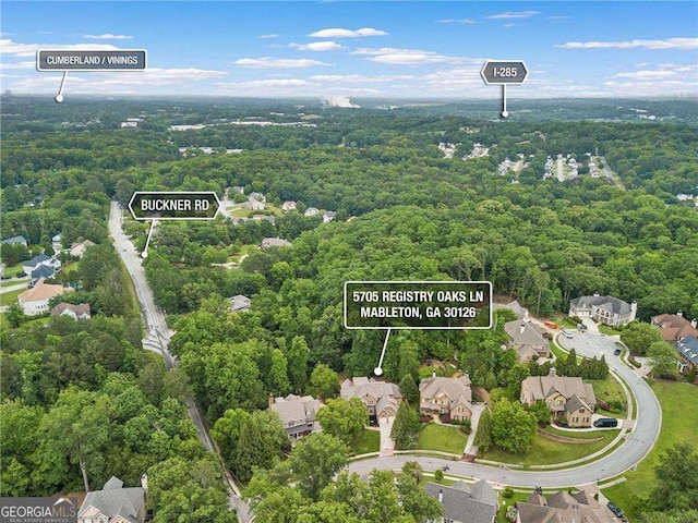 5705 Registry Oaks Ln SE, Mableton, GA 30126 - aerial view of residential area featuring a forest and property parcel outlined