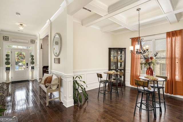 6861 Louis Dr, Locust Grove, GA 30248 - foyer entrance featuring dark wood finished floors, beam ceiling, a chandelier, coffered ceiling, and a wainscoted wall
