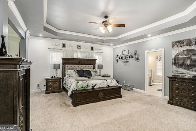 6861 Louis Dr, Locust Grove, GA 30248 - bedroom featuring a raised ceiling, light carpet, crown molding, baseboards, and ensuite bath