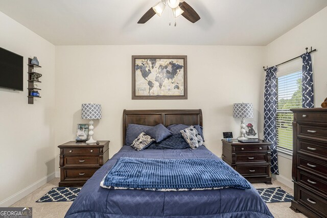 6861 Louis Dr, Locust Grove, GA 30248 - bedroom with light carpet, baseboards, and a ceiling fan