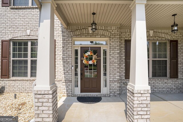 6861 Louis Dr, Locust Grove, GA 30248 - entrance to property with covered porch and brick siding