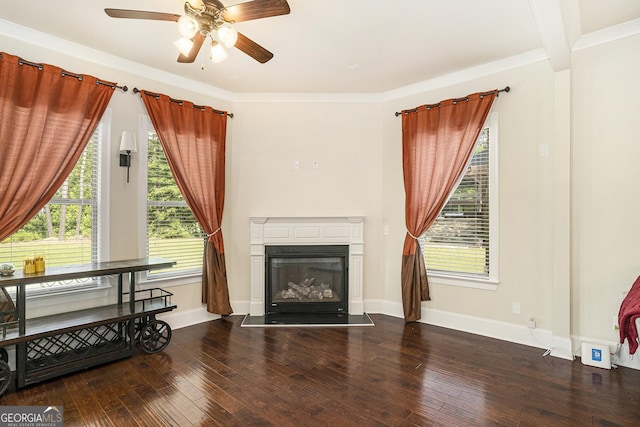 6861 Louis Dr, Locust Grove, GA 30248 - living room featuring a ceiling fan, a glass covered fireplace, hardwood / wood-style flooring, and baseboards