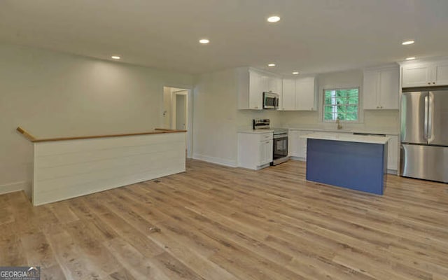 340 Currahee Trl, Toccoa, GA 30577 - kitchen featuring appliances with stainless steel finishes, white cabinets, recessed lighting, a kitchen island, and baseboards