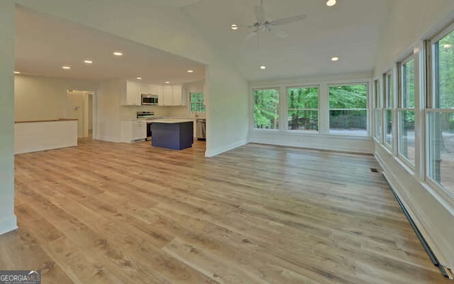 340 Currahee Trl, Toccoa, GA 30577 - unfurnished living room with recessed lighting, light wood-type flooring, ceiling fan, lofted ceiling, and baseboards