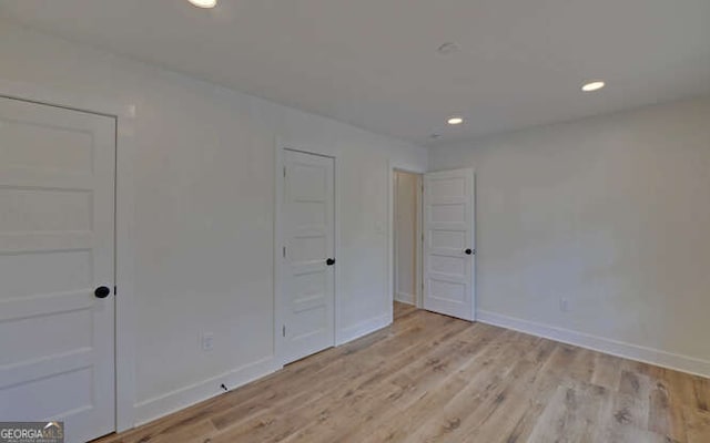 340 Currahee Trl, Toccoa, GA 30577 - unfurnished bedroom featuring light wood finished floors, baseboards, and recessed lighting