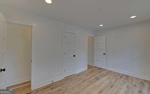 340 Currahee Trl, Toccoa, GA 30577 - unfurnished bedroom featuring light wood-style floors, baseboards, and recessed lighting