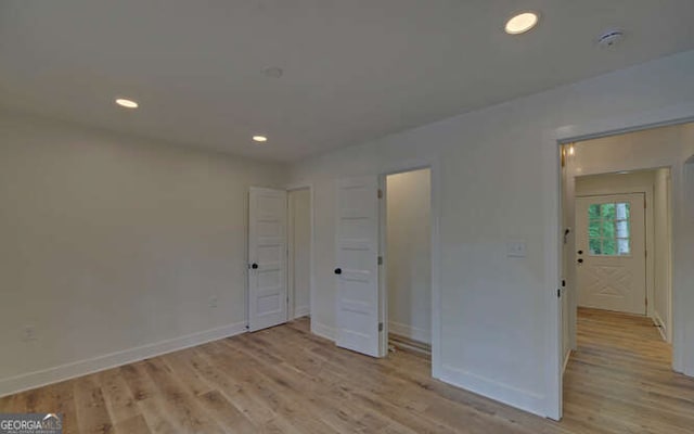 340 Currahee Trl, Toccoa, GA 30577 - unfurnished bedroom with baseboards, light wood-type flooring, and recessed lighting