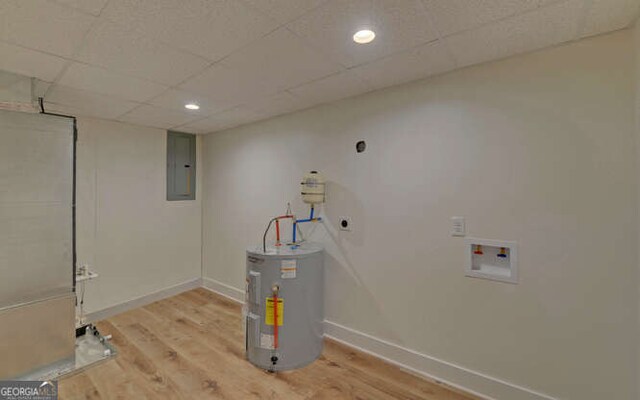 340 Currahee Trl, Toccoa, GA 30577 - laundry area with hookup for an electric dryer, water heater, electric panel, wood finished floors, and recessed lighting