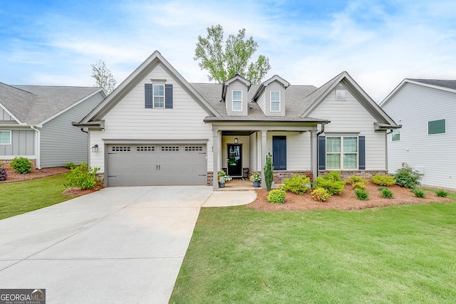 4581 Blacksmith Ln, Jefferson, GA 30549 - view of front facade featuring a front yard, concrete driveway, an attached garage, a shingled roof, and stone siding