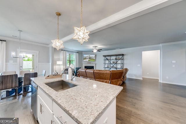 4581 Blacksmith Ln, Jefferson, GA 30549 - kitchen featuring a sink, a fireplace, dark wood-style floors, a chandelier, and open floor plan