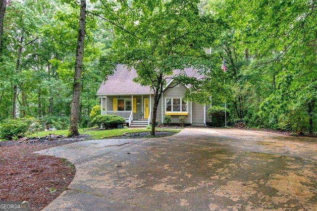 34 Sassafras Grv, Dawsonville, GA 30534 - view of front of house featuring a porch and driveway