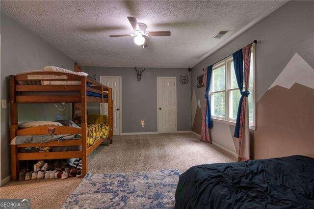 34 Sassafras Grv, Dawsonville, GA 30534 - bedroom with a textured ceiling, carpet flooring, baseboards, and a ceiling fan