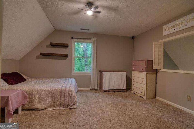 34 Sassafras Grv, Dawsonville, GA 30534 - bedroom featuring a textured ceiling, vaulted ceiling, baseboards, carpet, and ceiling fan