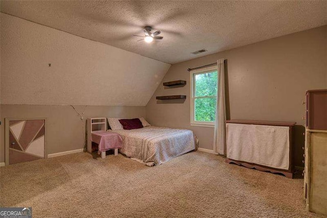 34 Sassafras Grv, Dawsonville, GA 30534 - bedroom featuring a textured ceiling, carpet, vaulted ceiling, baseboards, and ceiling fan