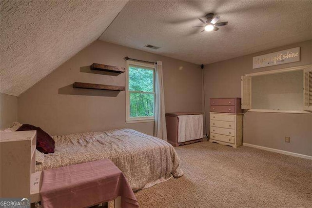 34 Sassafras Grv, Dawsonville, GA 30534 - carpeted bedroom featuring a textured ceiling, vaulted ceiling, baseboards, and ceiling fan