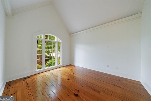 7 Hogan Ln NW, Rome, GA 30165 - empty room with crown molding, hardwood / wood-style floors, and lofted ceiling