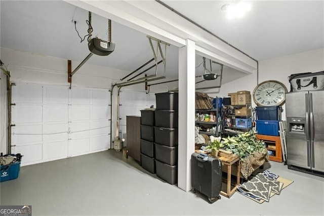 10735 Pinewalk Forest Cir, Alpharetta, GA 30022 - garage featuring stainless steel refrigerator with ice dispenser and a garage door opener