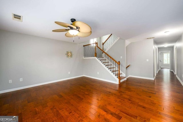 4916 Gathering Pl, Suwanee, GA 30024 - unfurnished living room with a ceiling fan, wood finished floors, and stairs