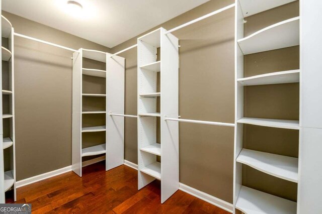 4916 Gathering Pl, Suwanee, GA 30024 - walk in closet with wood finished floors