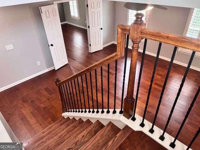 4916 Gathering Pl, Suwanee, GA 30024 - stairway with wood finished floors and ceiling fan