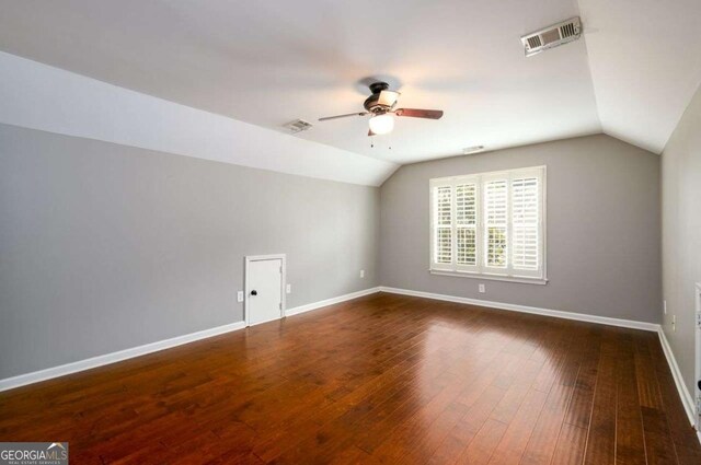 4916 Gathering Pl, Suwanee, GA 30024 - additional living space with lofted ceiling, ceiling fan, and dark wood-style flooring