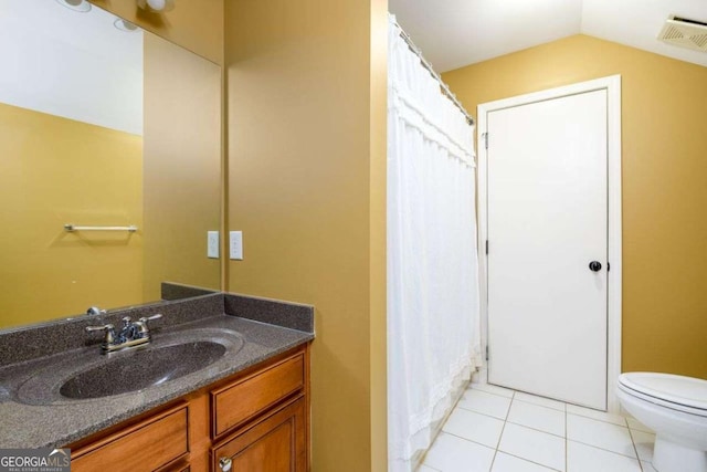 4916 Gathering Pl, Suwanee, GA 30024 - bathroom featuring vanity, tile patterned flooring, and vaulted ceiling
