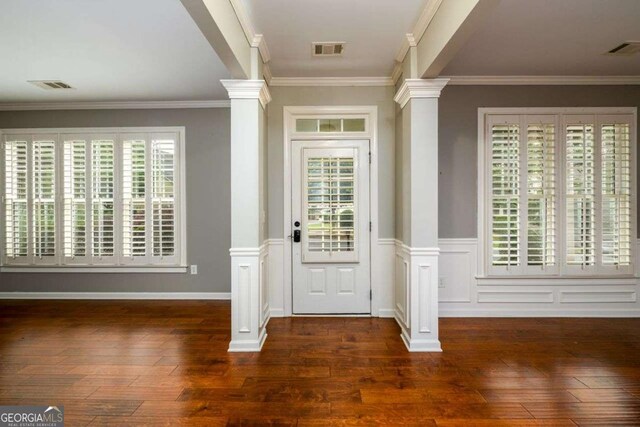 4916 Gathering Pl, Suwanee, GA 30024 - entryway featuring decorative columns, dark wood-type flooring, and crown molding