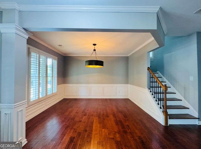 4916 Gathering Pl, Suwanee, GA 30024 - unfurnished dining area with dark wood-style floors, stairs, a wainscoted wall, and ornamental molding