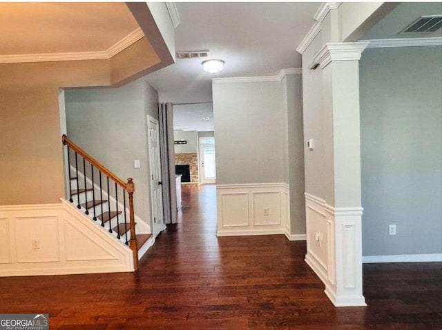 4916 Gathering Pl, Suwanee, GA 30024 - hall featuring dark wood finished floors, stairway, wainscoting, crown molding, and a decorative wall