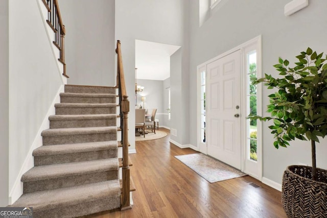224 Mountain View Dr, Woodstock, GA 30188 - foyer featuring stairway, wood finished floors, baseboards, and a high ceiling