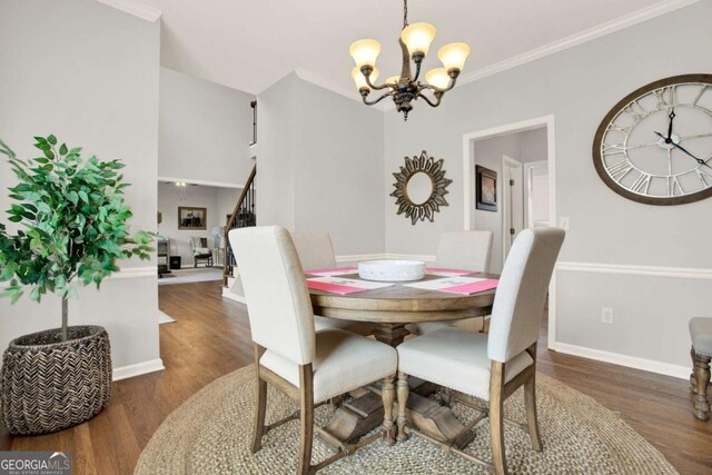 224 Mountain View Dr, Woodstock, GA 30188 - dining area featuring a chandelier, wood finished floors, baseboards, stairs, and crown molding