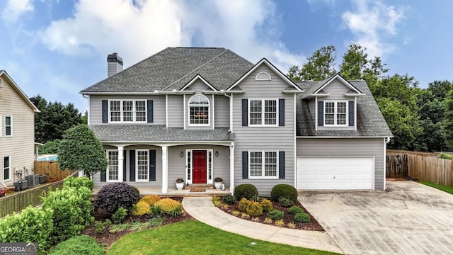 224 Mountain View Dr, Woodstock, GA 30188 - traditional-style home featuring covered porch, driveway, a shingled roof, an attached garage, and a chimney