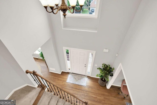 224 Mountain View Dr, Woodstock, GA 30188 - foyer featuring a chandelier, plenty of natural light, a towering ceiling, baseboards, and stairway