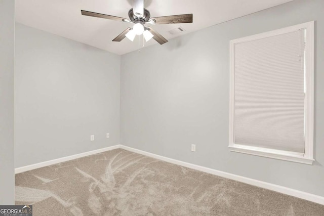 224 Mountain View Dr, Woodstock, GA 30188 - spare room featuring carpet flooring, baseboards, and a ceiling fan