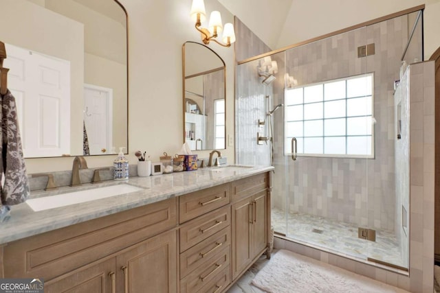 224 Mountain View Dr, Woodstock, GA 30188 - bathroom featuring a shower stall, double vanity, lofted ceiling, and a chandelier
