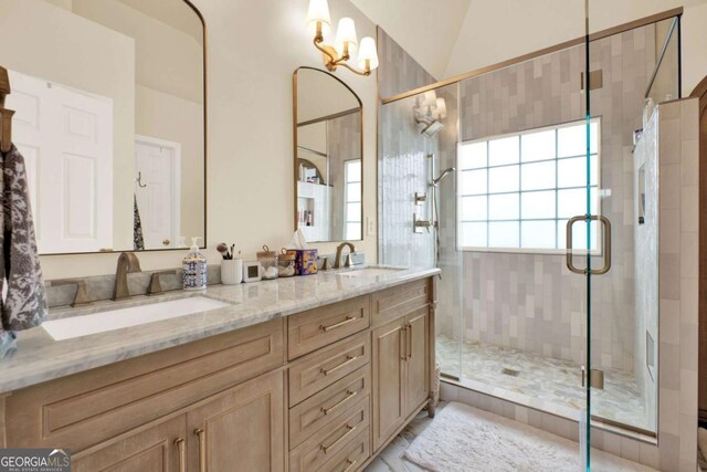 224 Mountain View Dr, Woodstock, GA 30188 - full bathroom with double vanity, a shower stall, and vaulted ceiling