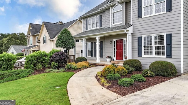 224 Mountain View Dr, Woodstock, GA 30188 - view of front facade featuring covered porch, a front lawn, and a shingled roof