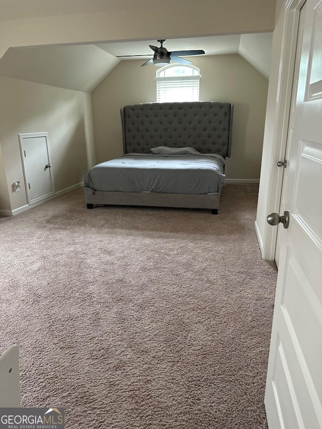 1749 Misselthrush Ln, Mcdonough, GA 30253 - carpeted bedroom with vaulted ceiling and a ceiling fan